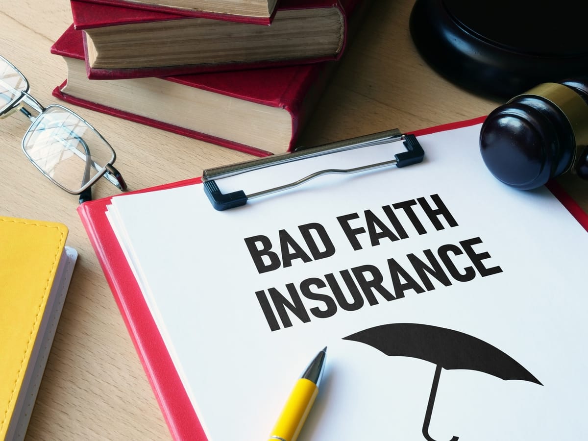 The words bad faith insurance written on a legal pad